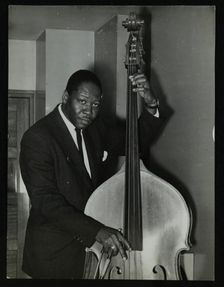 Portrait of American double bass player Curtis Counce, c1950s. Creator: Denis Williams