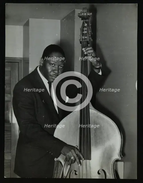 Portrait of American double bass player Curtis Counce, c1950s. Creator: Denis Williams.