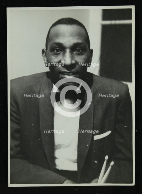 Portrait of American drummer Cozy Cole, 1950s. Creator: Denis Williams.
