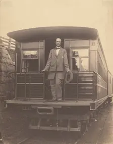 Portrait of an unidentified man standing on rear platform of a train, about 1863. Creator: Unknown