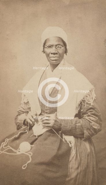 Portrait of abolitionist Sojourner Truth, sitting with yarn and knitting needles, 1864. Creator: JH Preiter.