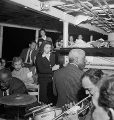 Portrait of Baby Dodds and Marty Marsala, Riverboat on the Hudson, N.Y., ca. July 1947. Creator: William Paul Gottlieb