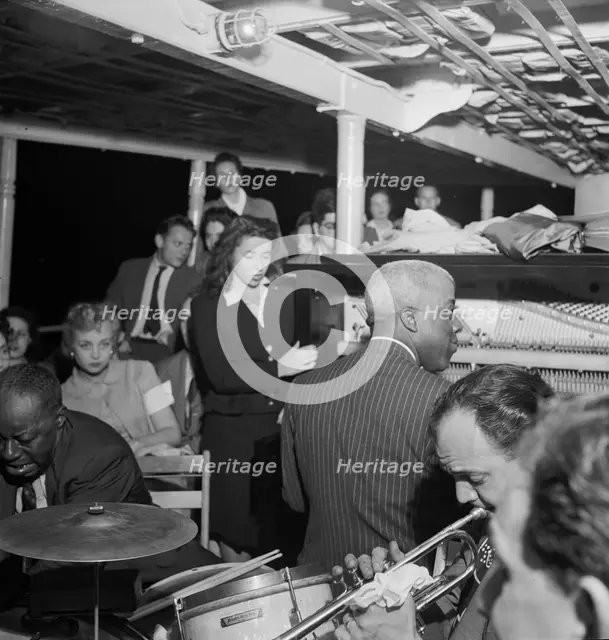 Portrait of Baby Dodds and Marty Marsala, Riverboat on the Hudson, N.Y., ca. July 1947. Creator: William Paul Gottlieb.