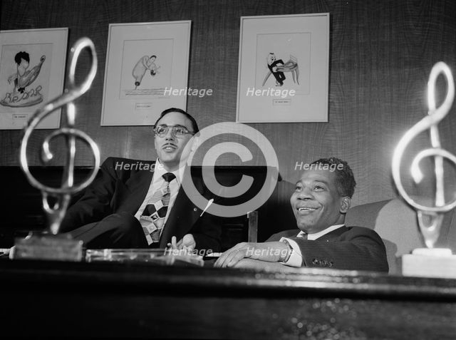 Portrait of Bernie Benjamin and George (George David) Weiss in their office, N.Y., ca. Apr. 1947. Creator: William Paul Gottlieb.