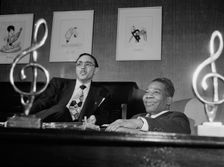Portrait of Bernie Benjamin and George (George David) Weiss in their office, N.Y., ca. Apr. 1947. Creator: William Paul Gottlieb