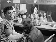 Portrait of Billie Holiday and Mister, Downbeat(?), New York, N.Y., ca. June 1946. Creator: William Paul Gottlieb