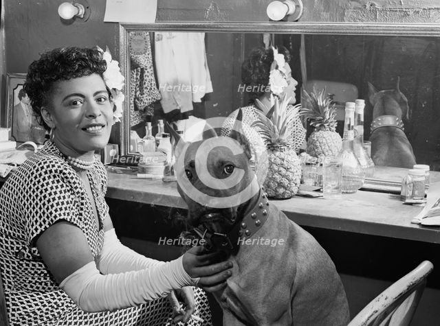 Portrait of Billie Holiday and Mister, Downbeat(?), New York, N.Y., ca. June 1946. Creator: William Paul Gottlieb.