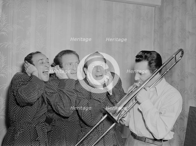 Portrait of Buddy Morrow and Ritz Brothers, New York, N.Y., ca. May 1947. Creator: William Paul Gottlieb.