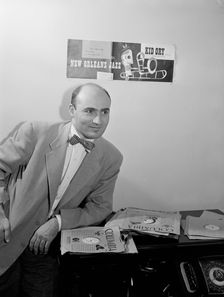Portrait of George Avakian in his office or home, New York, N.Y.(?), 1938. Creator: William Paul Gottlieb