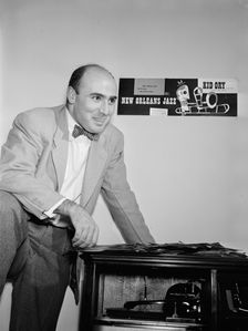 Portrait of George Avakian in his office or home, New York, N.Y.(?), 1938. Creator: William Paul Gottlieb