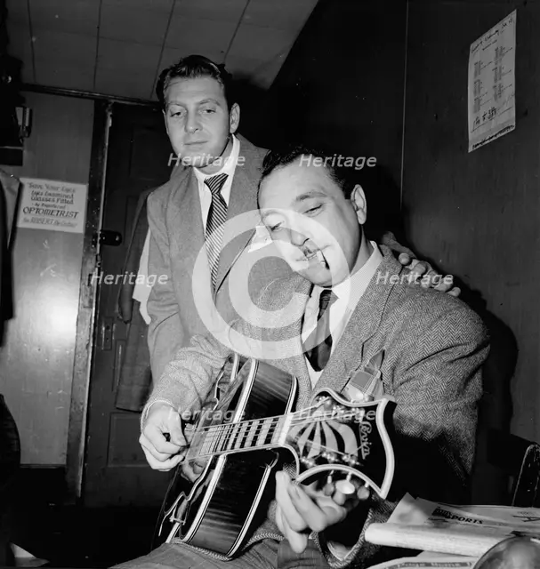 Portrait of Django Reinhardt and David Rose, Aquarium, New York, N.Y., ca. Nov. 1946. Creator: William Paul Gottlieb.