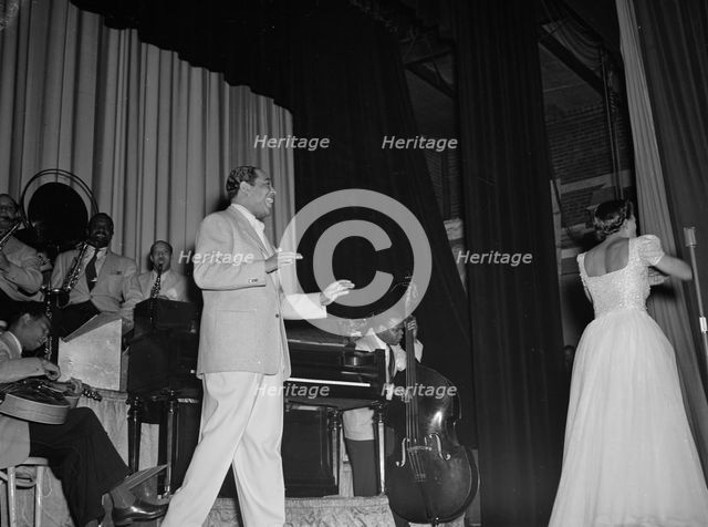 Portrait of Duke Ellington, Barney Bigard, Ben..., Howard Theater(?), Washington, D.C., 1938. Creator: William Paul Gottlieb.