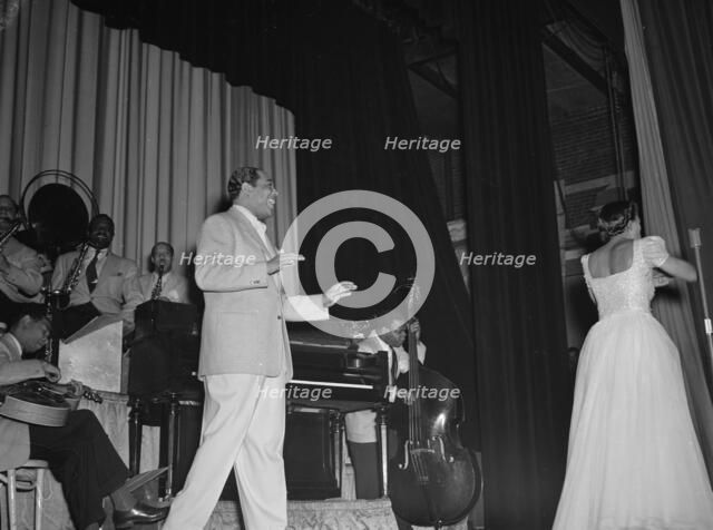 Portrait of Duke Ellington, Barney Bigard, Ben..., Howard Theater(?), Washington, D.C., 1938. Creator: William Paul Gottlieb.