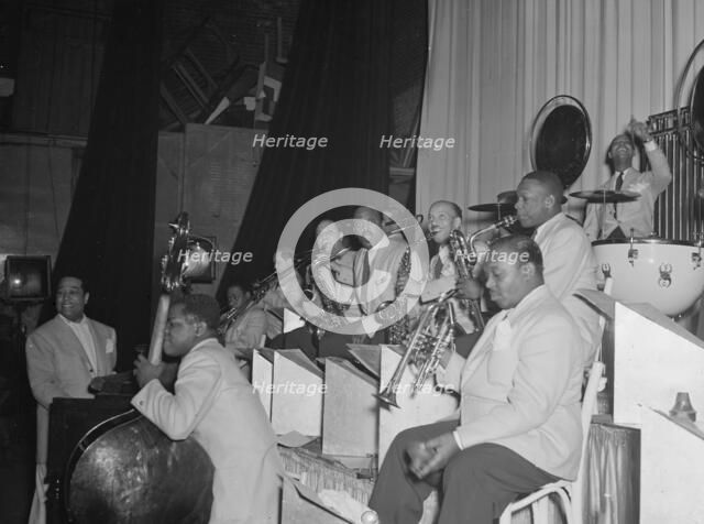 Portrait of Duke Ellington, Junior Raglin, Tricky..., Howard Theater(?), Washington, D.C., 1938. Creator: William Paul Gottlieb.