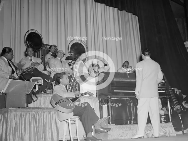 Portrait of Duke Ellington, Junior Raglin, Juan Tizol...Howard Theater(?), Washington, D.C., 1938. Creator: William Paul Gottlieb.