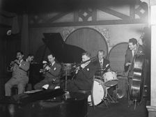 Portrait of Ernie Caceres, Bobby Hackett, Freddie Ohms, and George Wettling, Nick's..., N.Y., 1946. Creator: William Paul Gottlieb
