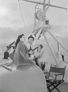 Portrait of Frank Raye and Betty Brewer, Ukelele Lady (yacht), Hudson River, N.Y., ca. June 1947. Creator: William Paul Gottlieb