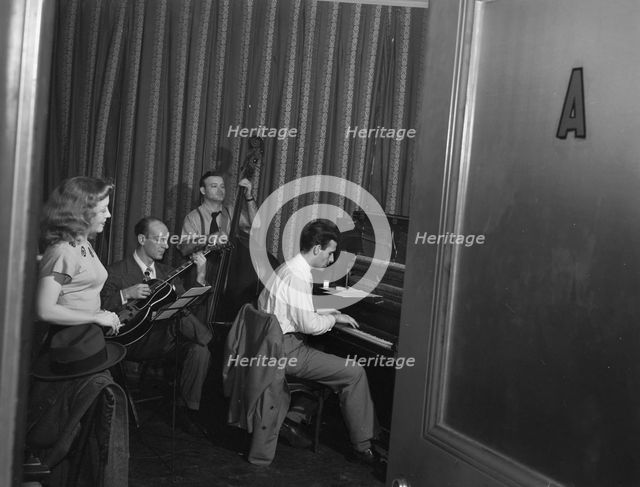 Portrait of Helen Carr, Sammy Herman, Joe Bianco, and Donn Trenner, Nola's, N.Y., ca. Feb. 1947. Creator: William Paul Gottlieb.