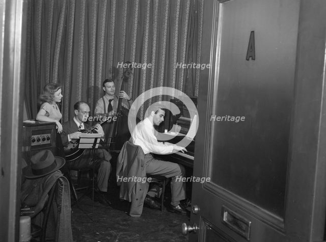 Portrait of Helen Carr, Sammy Herman, Joe Bianco, and Donn Trenner, Nola's, N.Y., ca. Feb. 1947. Creator: William Paul Gottlieb.