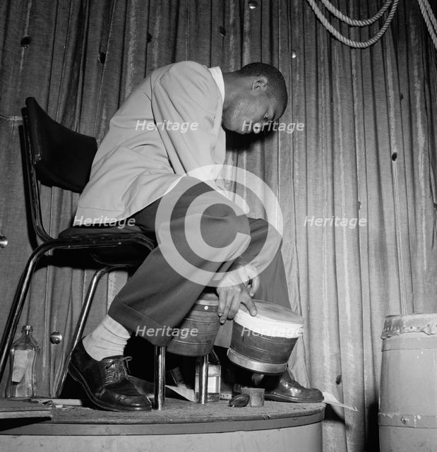 Portrait of Jose Mangual, Glen Island Casino, New York, N.Y., ca. July 1947. Creator: William Paul Gottlieb.