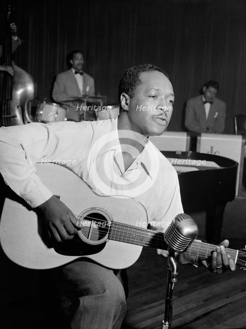 Portrait of Josh White, Café Society (Downtown), New York, N.Y., ca. June 1946. Creator: William Paul Gottlieb.
