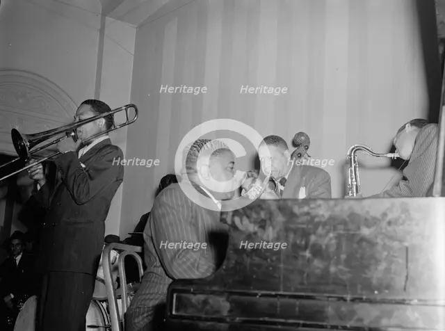 Portrait of Jay Higginbotham, Pete Johnson, Henry Allen, and Lester Young... Washington, D.C., c1940 Creator: William Paul Gottlieb.