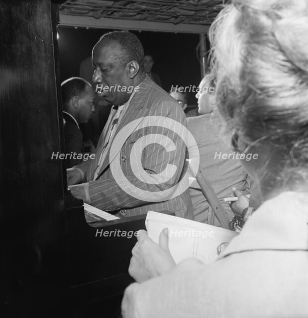 Portrait of James P. (James Price) Johnson, Riverboat on the Hudson, N.Y., ca. July 1947. Creator: William Paul Gottlieb.