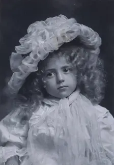 Portrait of little girl in frilly hat, c1900. Creator: Addie Kilburn Robinson