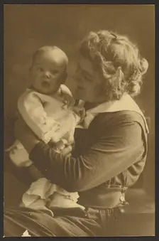 Portrait of Mother Smiling at Child, 1907-1924. Creator: Louis Fleckenstein