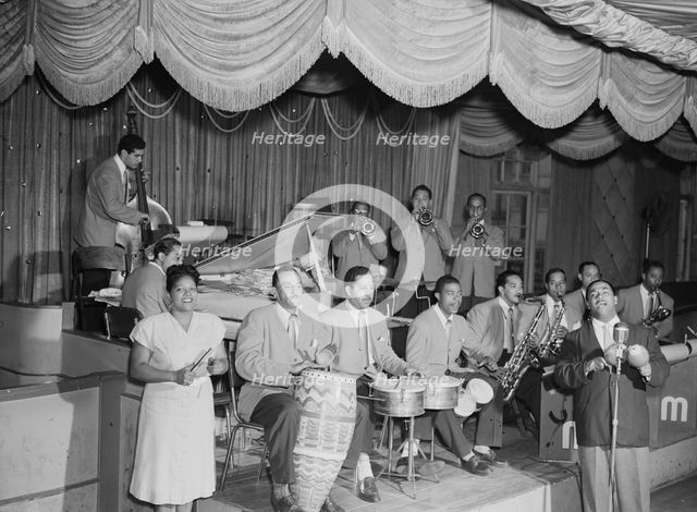 Portrait of Machito, Jose Mangual, Carlos Vidal(?), Mario Bouza...Glen Island Casino, N.Y., 1947. Creator: William Paul Gottlieb.