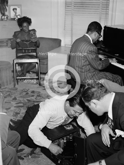 Portrait of Mary Lou Williams, Dizzy Gillespie, Jack...Mary Lou Williams' apartment, N.Y., 1947. Creator: William Paul Gottlieb.