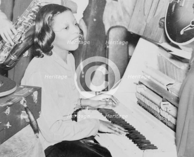 Portrait of Mary Lou Williams, Howard Theater, Washington, D.C., 1938. Creator: William Paul Gottlieb.