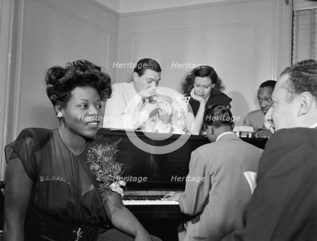 Portrait of Mary Lou Williams, Jack Teagarden, Dixie Bailey...Mary Lou Williams' apartment, NY, 1947 Creator: William Paul Gottlieb.