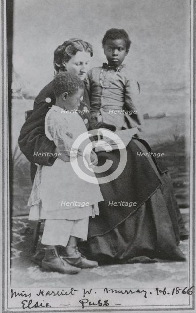 Portrait of Sea Island School teacher Miss Harriet W. Murray, with students Elsie and Puss, 1866-02. Creator: Unknown.
