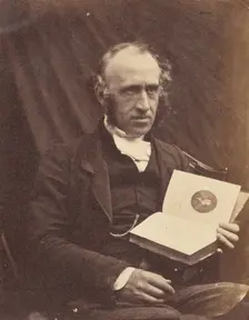 Portrait of Seated Man with a Book, 1870-1875. Creator: Unknown