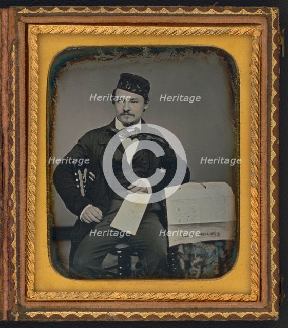Portrait of seated man holding the Charleston Zeitung, possibly the owner of the newspaper..., 1853. Creator: Unknown.