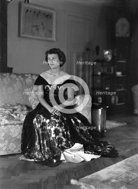 Portrait of seated woman in evening dress, (Isle of Wight?), c1935.  Creator: Kirk & Sons of Cowes.