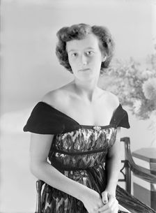 Portrait of seated woman in evening dress, (Isle of Wight?), c1935. Creator: Kirk & Sons of Cowes
