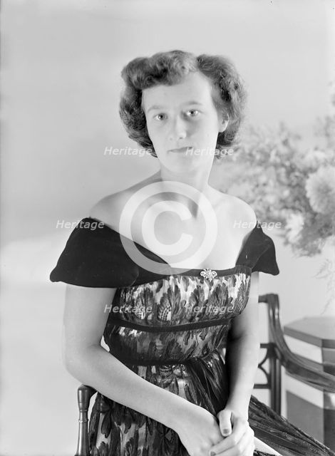 Portrait of seated woman in evening dress, (Isle of Wight?), c1935.  Creator: Kirk & Sons of Cowes.