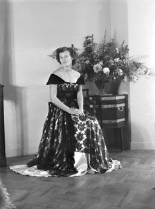 Portrait of seated woman in evening dress, (Isle of Wight?), c1935. Creator: Kirk & Sons of Cowes
