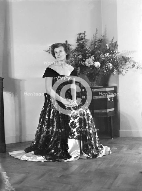 Portrait of seated woman in evening dress, (Isle of Wight?), c1935.  Creator: Kirk & Sons of Cowes.