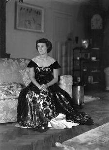 Portrait of seated woman in evening dress, (Isle of Wight?), c1935. Creator: Kirk & Sons of Cowes