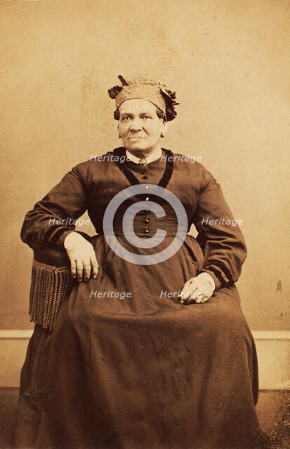 Portrait of seated woman wearing a headwrap, c1870. Creator: Thomas M Saurman.