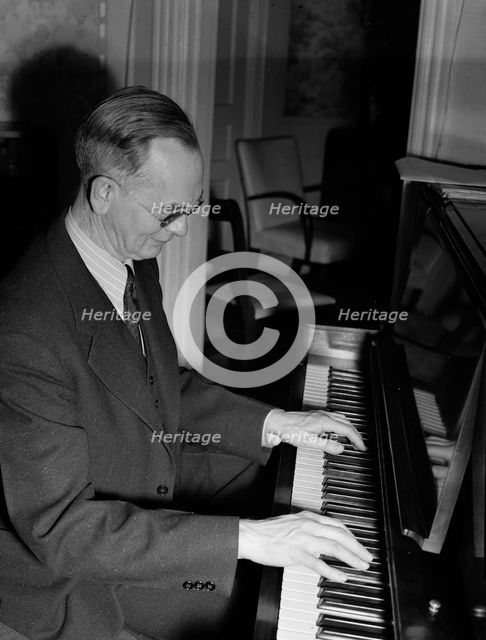 Portrait of Roy J. Carew in his home, 818 Quintana Place NW, Washington, D.C., ca. Feb. 1942. Creator: William Paul Gottlieb.
