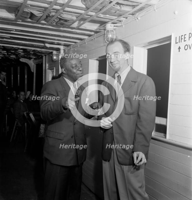 Portrait of Rudi Blesh and Baby Dodds, Riverboat on the Hudson, N.Y., ca. July 1947. Creator: William Paul Gottlieb.