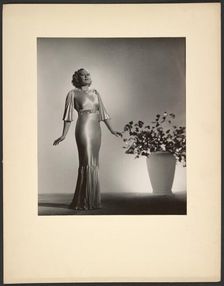 Portrait of woman in gown, late 1930s. Creator: Gunther Krampf