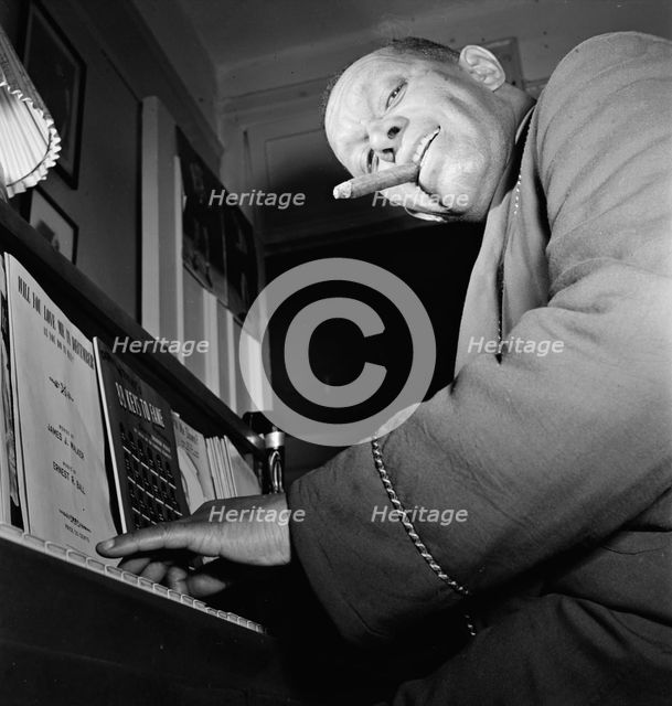 Portrait of Willie Smith in his apartment, Manhattan, New York, N.Y., ca. Jan. 1947. Creator: William Paul Gottlieb.