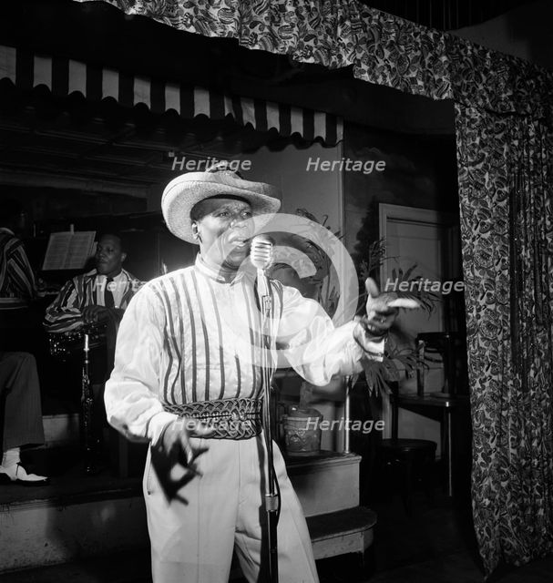 Portrait of Wilmoth Houdini, Renaissance Ballroom, New York, N.Y., ca. July, 1947. Creator: William Paul Gottlieb.