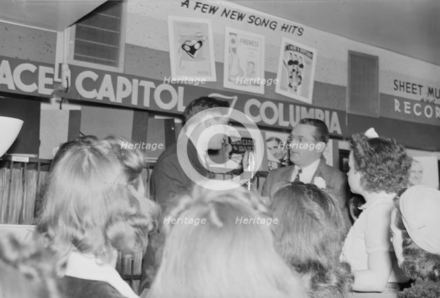 Portrait of Tommy Dorsey and William P. Gottlieb, record store, Washington, D.C., ca. 1940. Creator: Delia Potofsky Gottlieb.