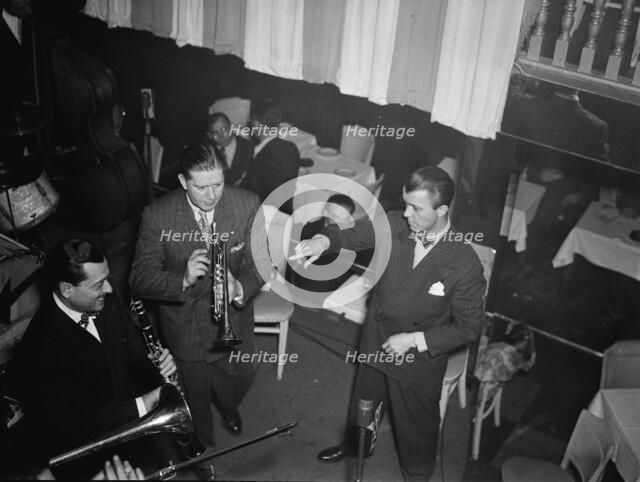Portrait of Tony Parenti, Wild Bill Davison, and Eddie Condon, Eddie Condon's, N.Y., ca. June 1946. Creator: William Paul Gottlieb.